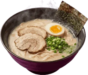 A bowl of ramen with pork slices, a soft-boiled egg and nori