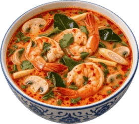 A bowl of tom yum soup with shrimp, mushrooms and herbs